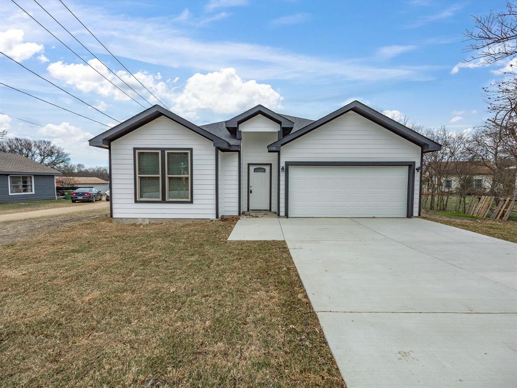 a house with trees in the background