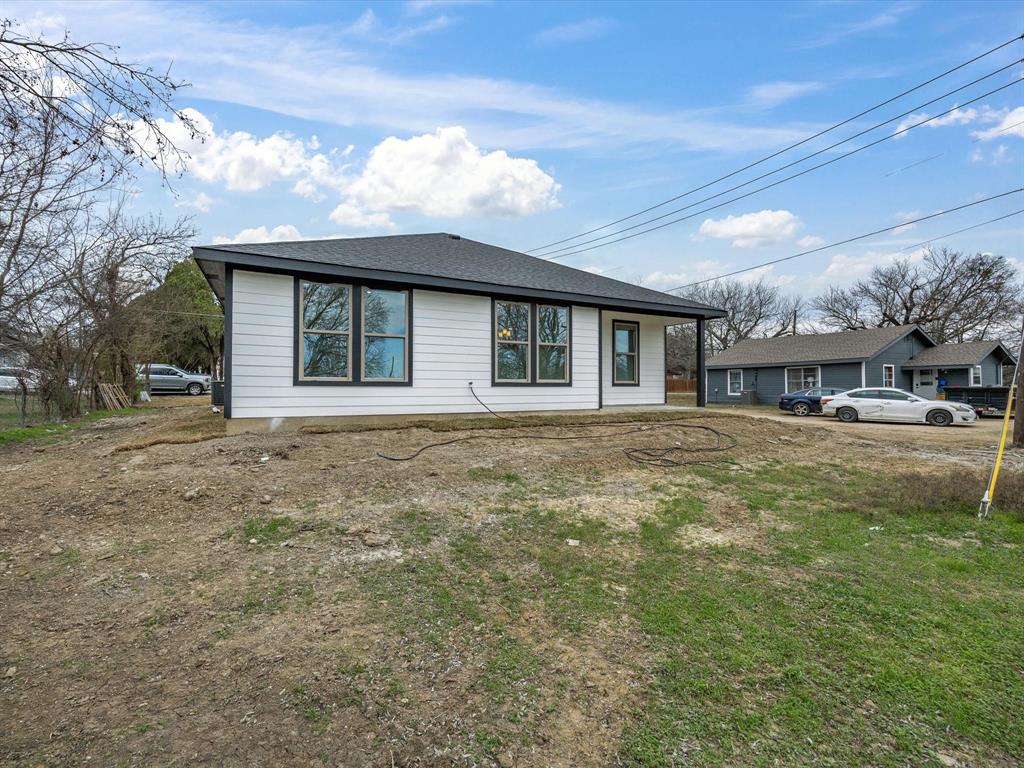 108 Couch Street Italy, TX 76651 - Photo 21 of 23 a front view of a house with a garden