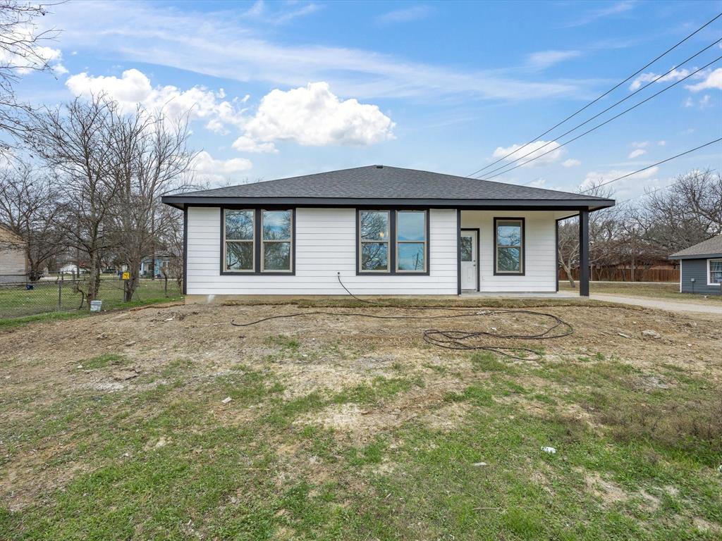 108 Couch Street Italy, TX 76651 - Photo 23 of 23 a front view of a house with a garden