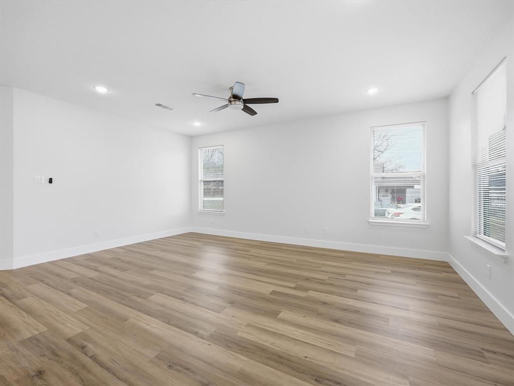 108 Couch Street Italy, TX 76651 - Photo 8 of 23 a view of empty room with wooden floor and fan