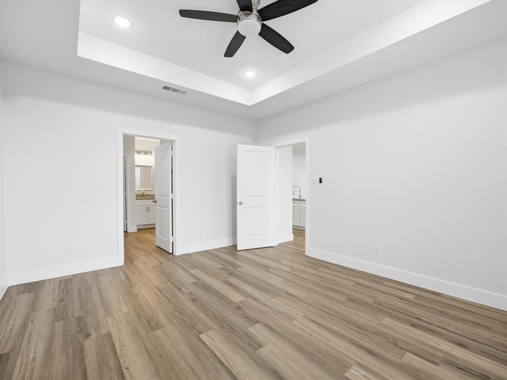 108 Couch Street Italy, TX 76651 - Photo 10 of 23 wooden floor in an empty room with a window