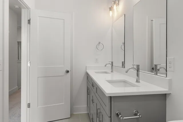 a bathroom with a sink and mirror