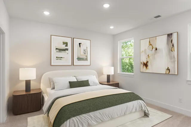 a bedroom with a large bed and a window