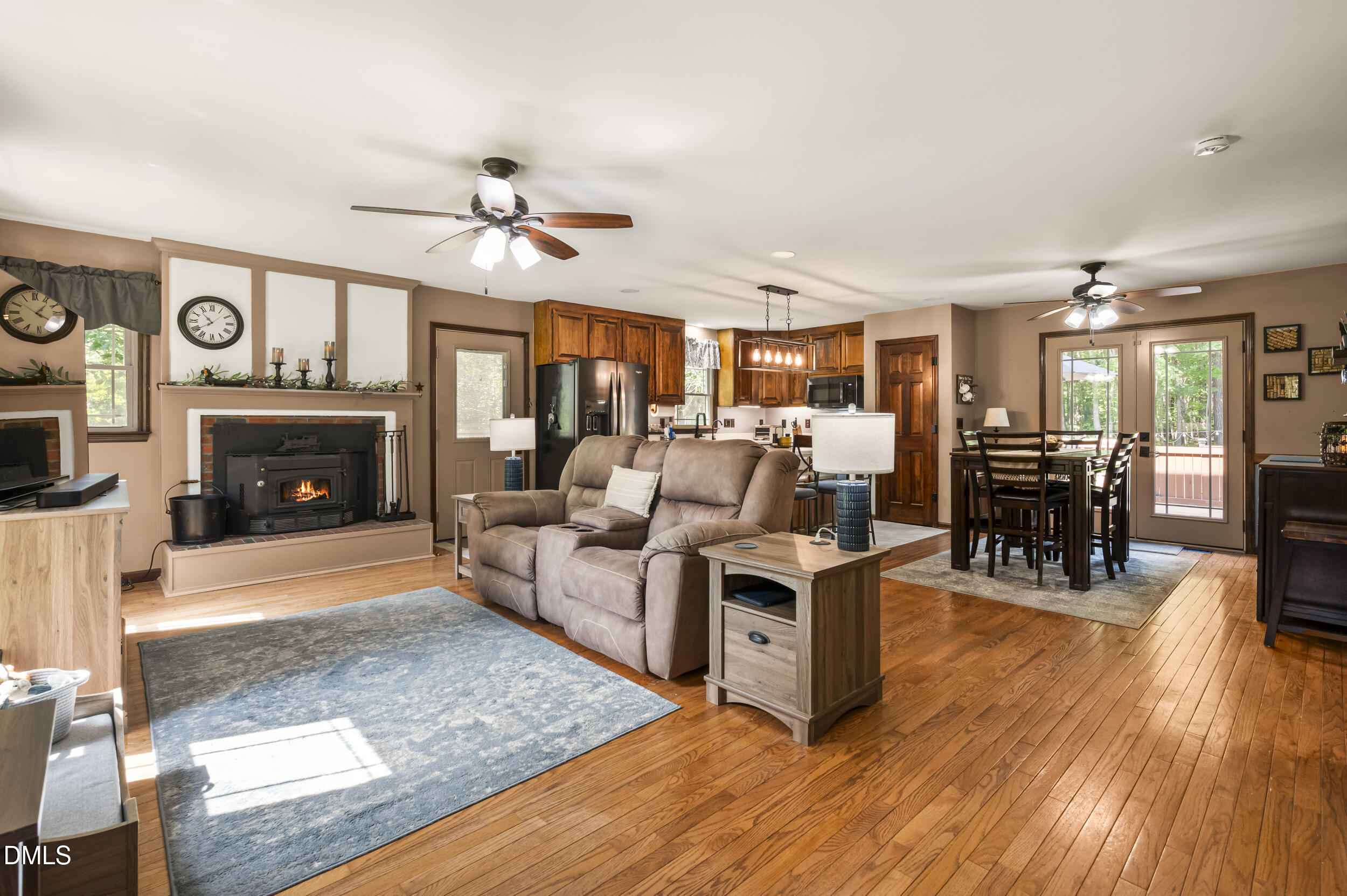 4209 Lassiter Road Wake Forest, NC 27587 - Photo 21 of 39 a living room with furniture a fireplace and a flat screen tv