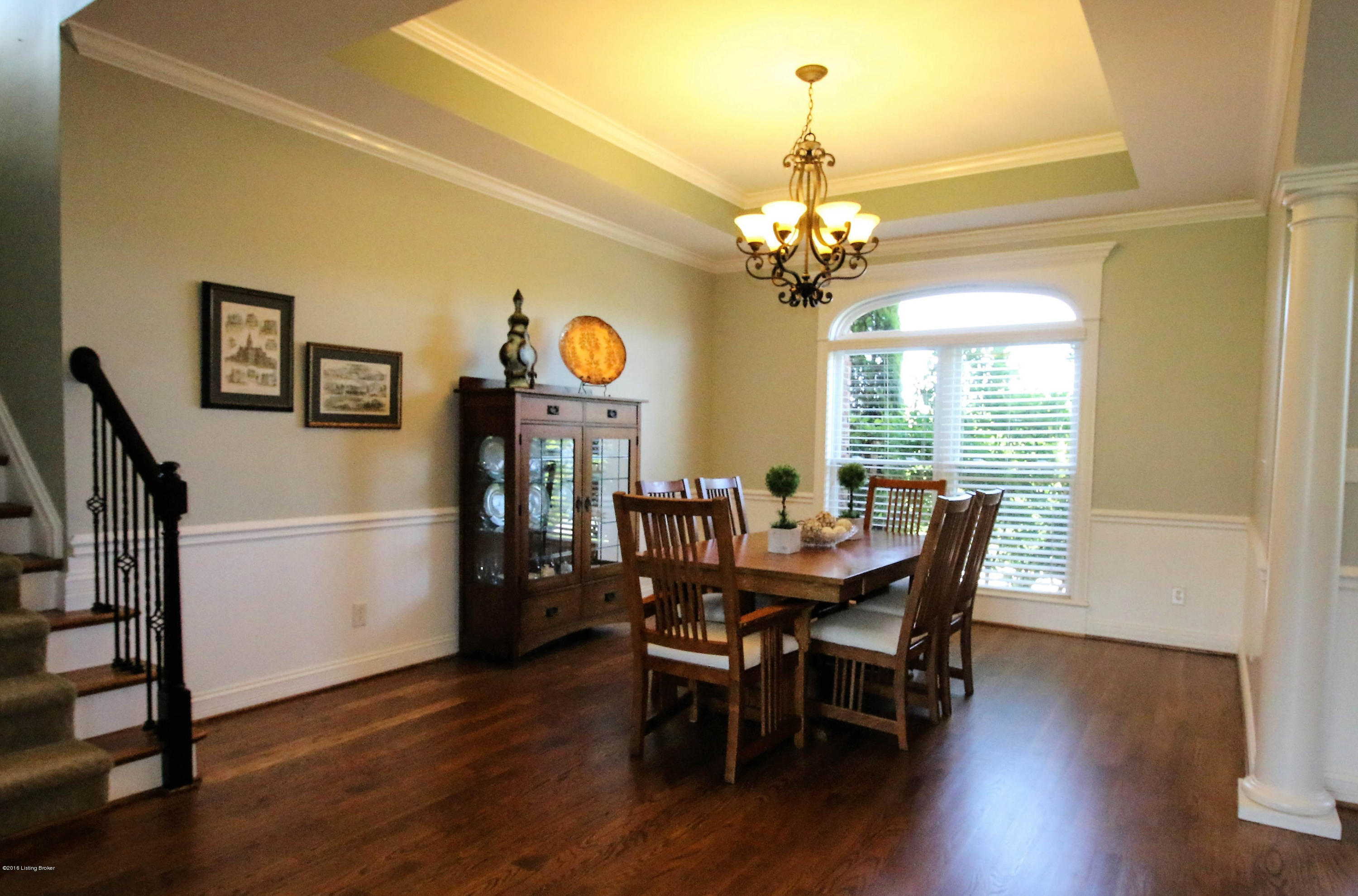 2904 Doe Ridge Court Prospect, KY 40059 - Photo 7 of 86 The formal dining room flows seamlessly from the foyer and features hardwood flooring, large windows with arched transom, and chair rail.