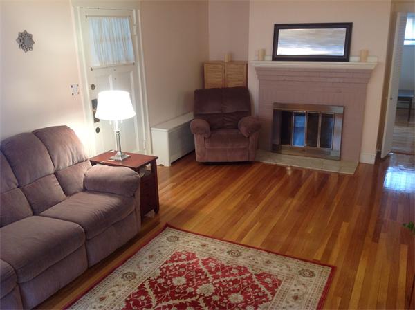47 Margaret Road Newton, MA 02461 - Photo 8 of 12 a living room with furniture and a fireplace