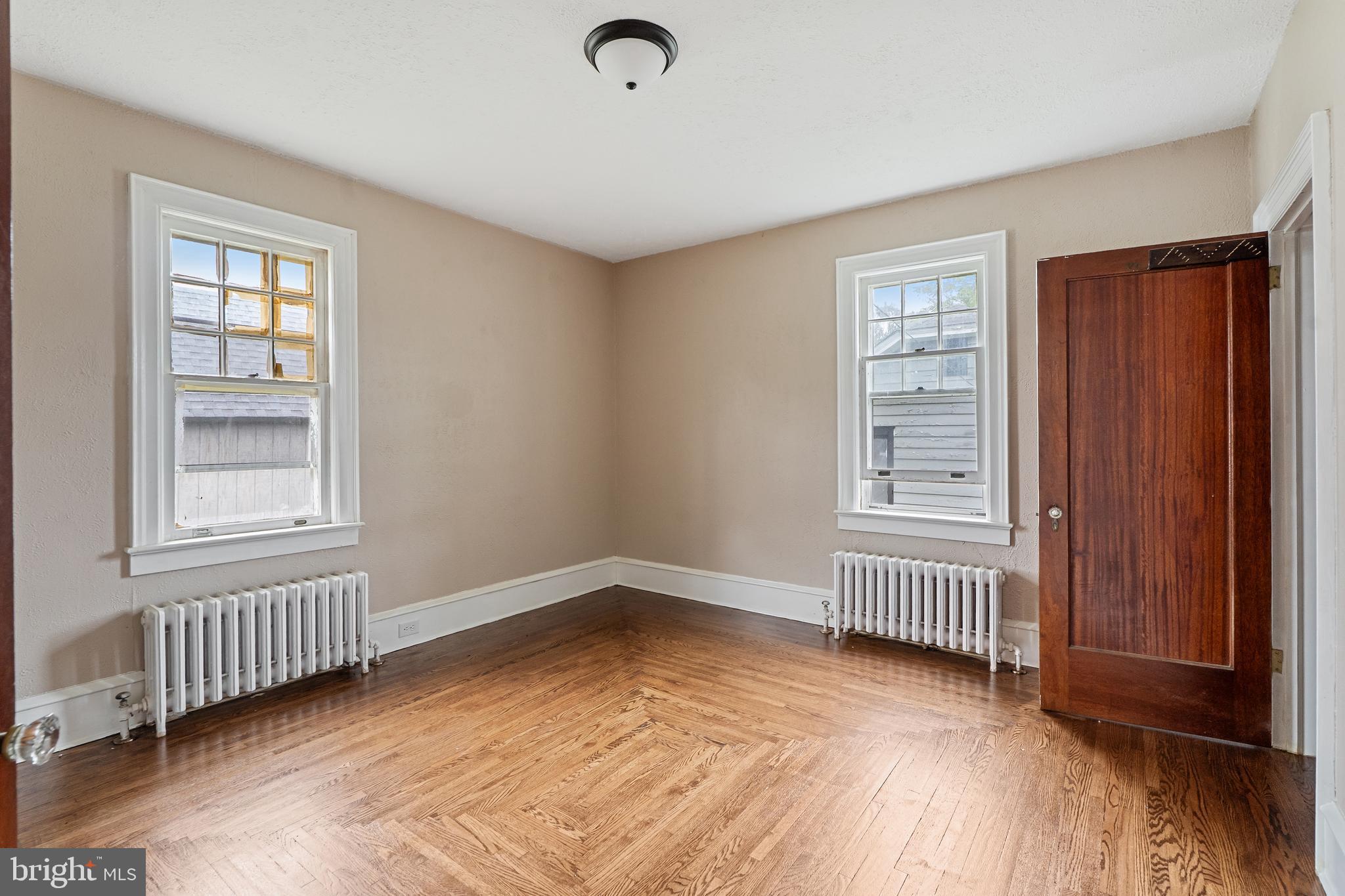 414 Main Street Dorchester, NJ 08316 - Photo 8 of 22 an empty room with windows