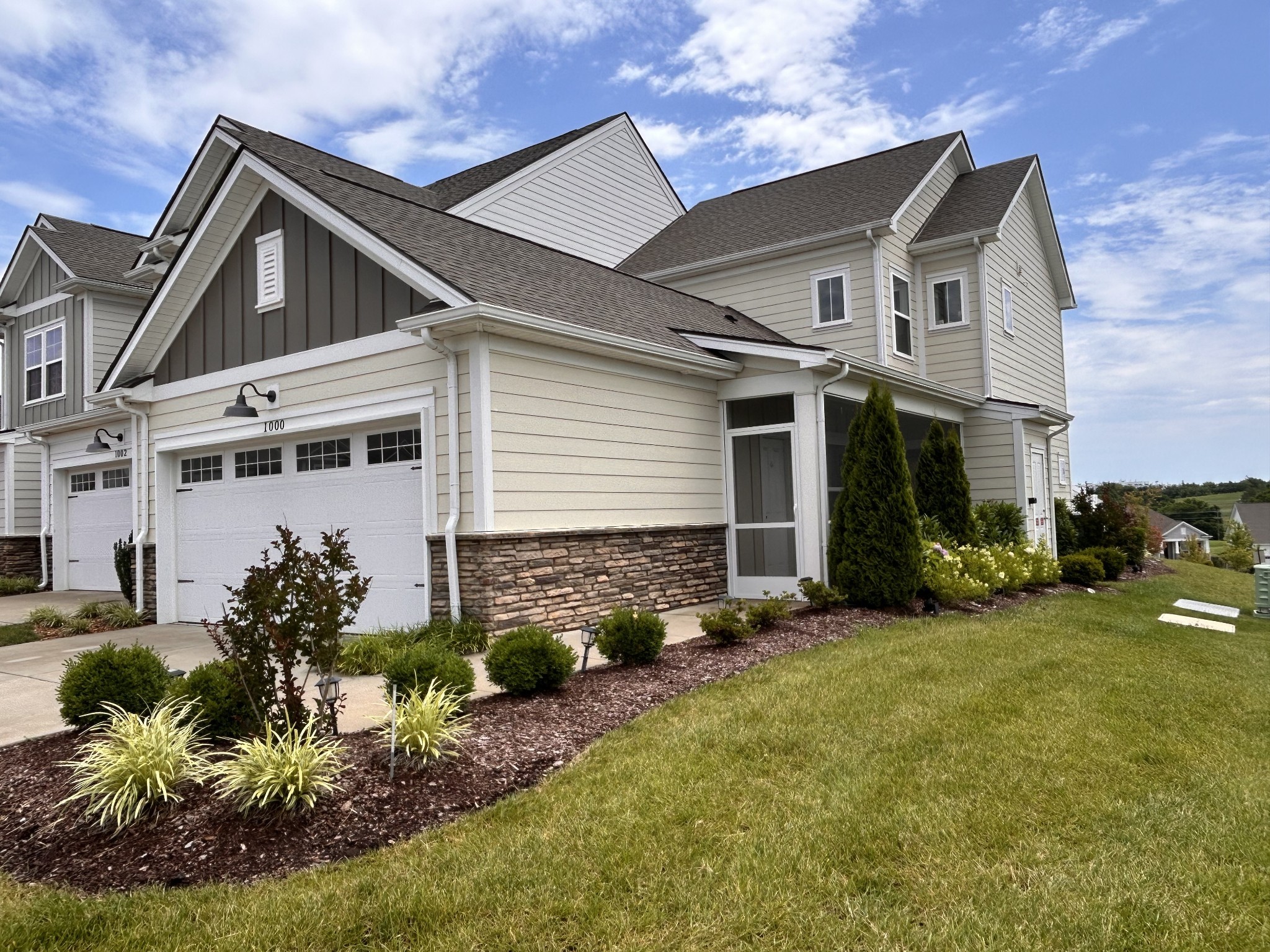 a front view of a house with garden