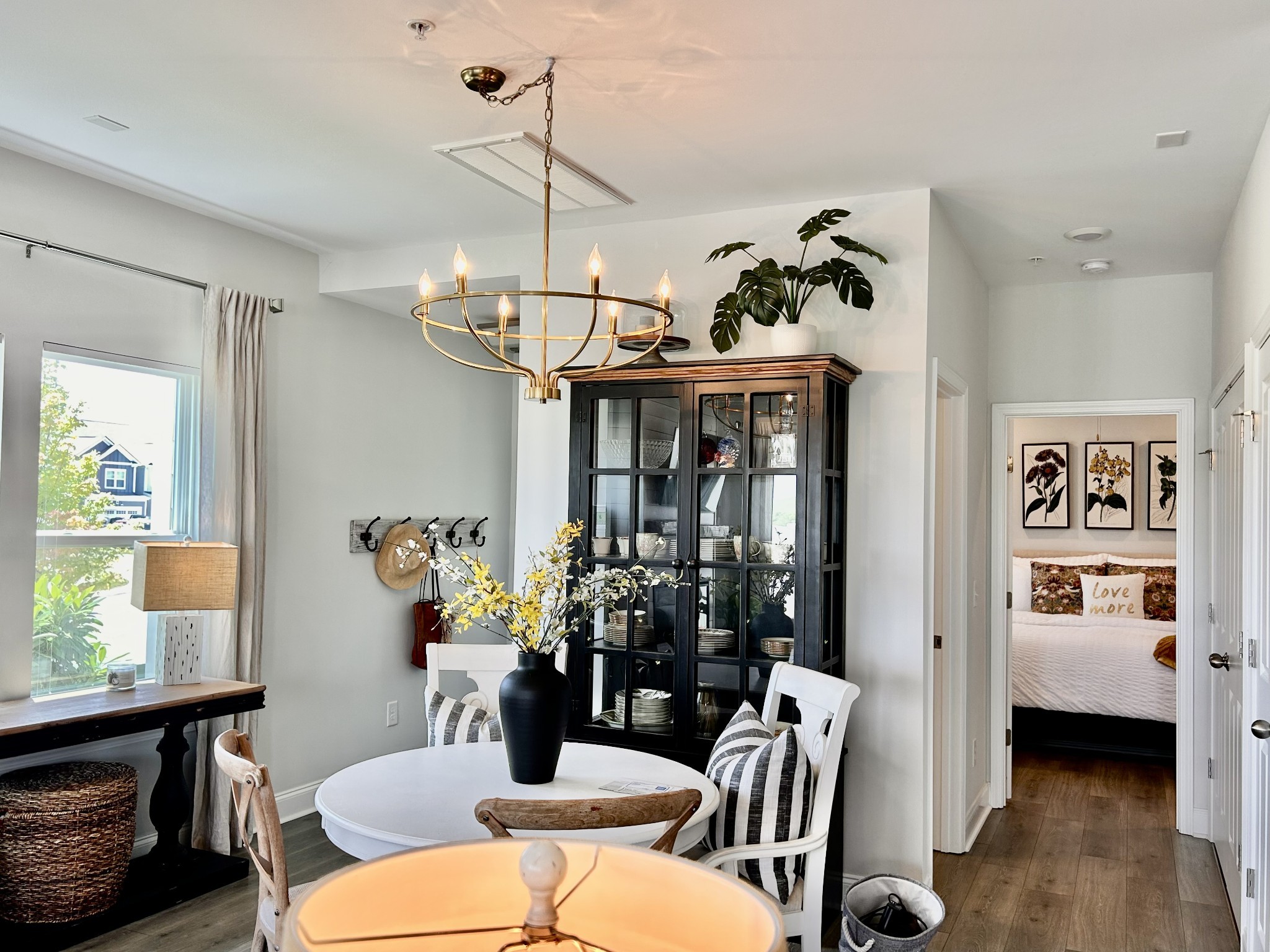 1000 June Wilde Ridge Spring Hill, TN 37174 - Photo 12 of 37 a view of a dining room with furniture a chandelier and wooden floor