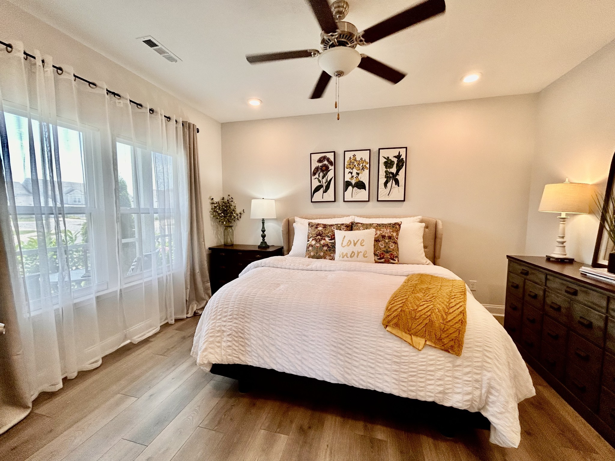 1000 June Wilde Ridge Spring Hill, TN 37174 - Photo 15 of 37 a bedroom with a large bed and a chandelier