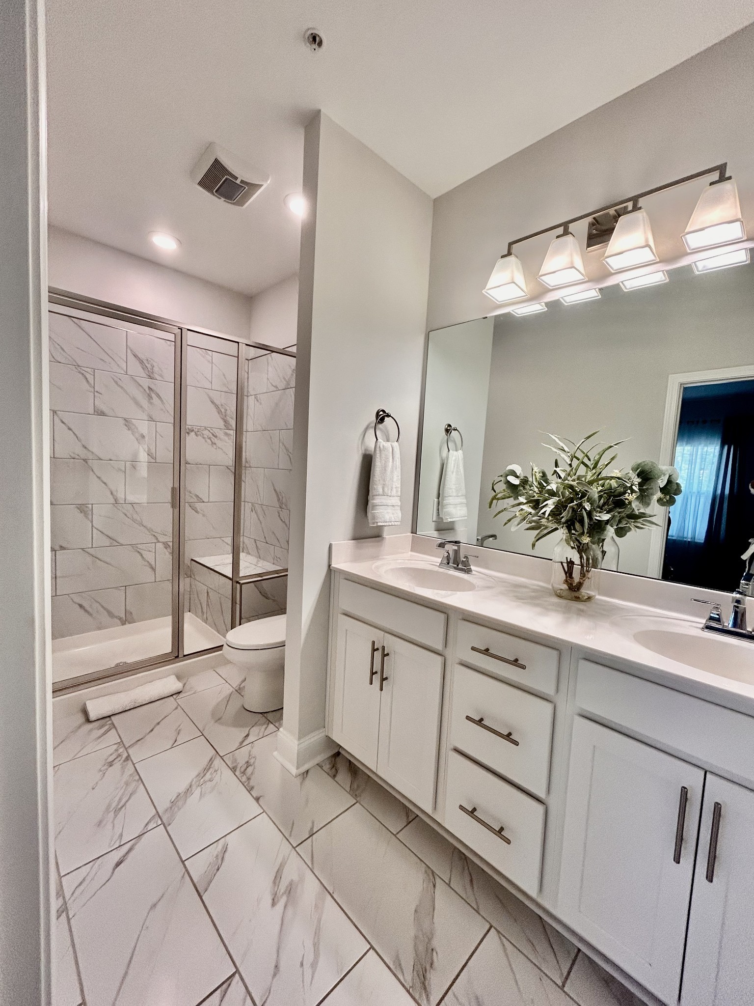 1000 June Wilde Ridge Spring Hill, TN 37174 - Photo 17 of 37 a spacious bathroom with a double vanity sink and a mirror