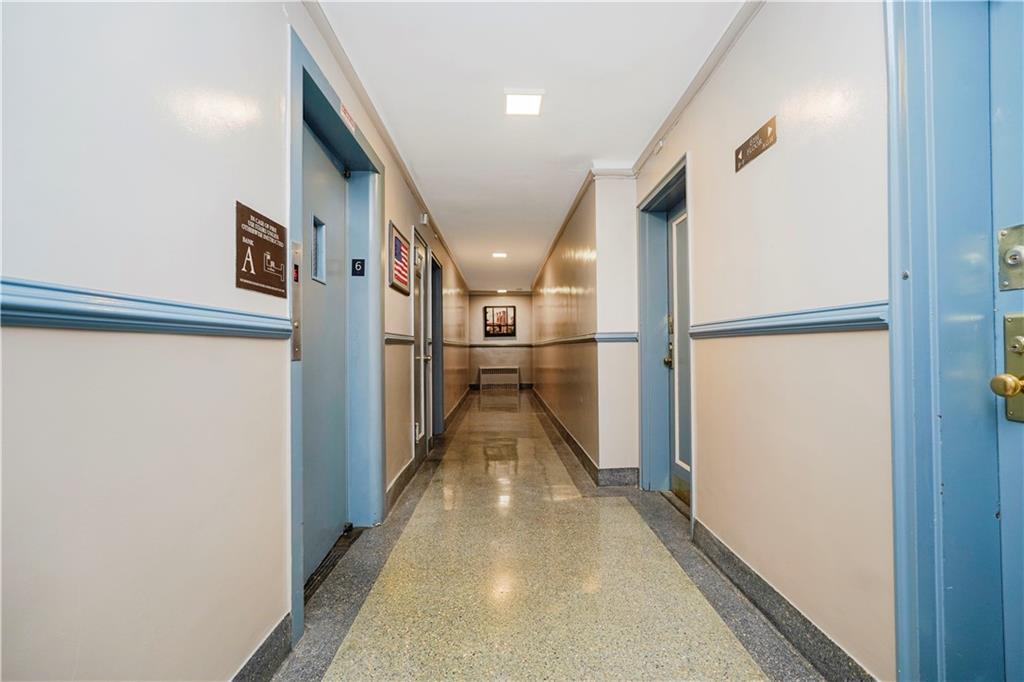 9430 Ridge Boulevard, Unit 6F Brooklyn, NY 11209 - Photo 4 of 15 a view of a hallway with wooden floor