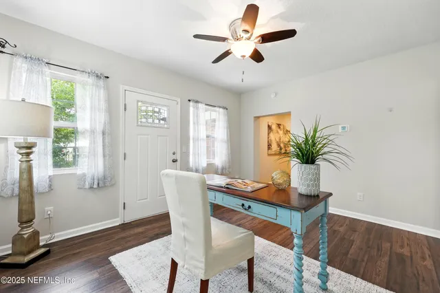 a dining room with furniture and window