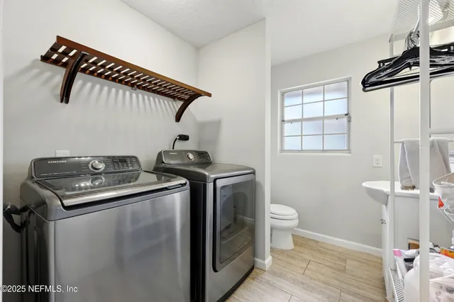 a utility room with dryer and washer