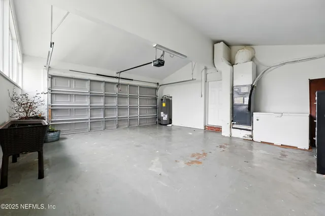 a view of empty room with wooden walls