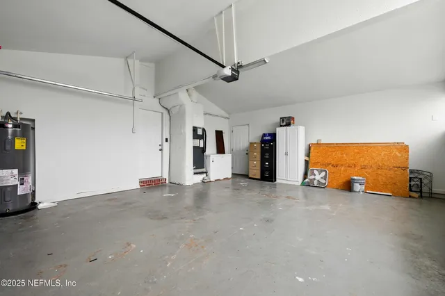 a view of an empty room with a fireplace