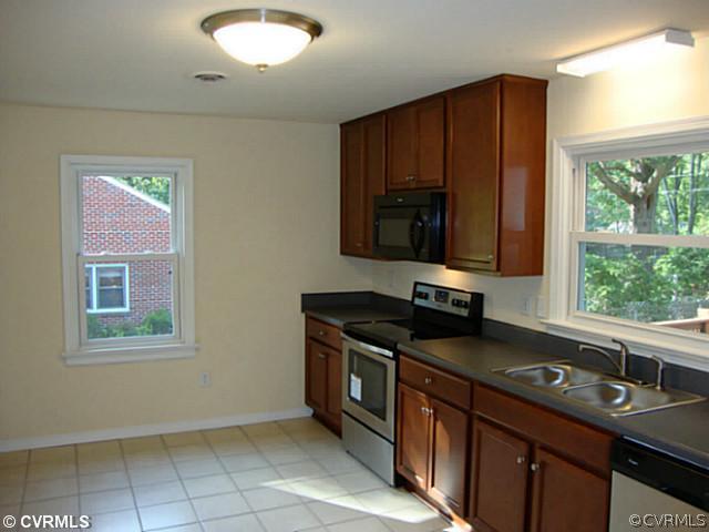 6620 Holborn Road Richmond, VA 23224 - Photo 7 of 20 Kitchen - Oversized Kitchen with tile new tile flo