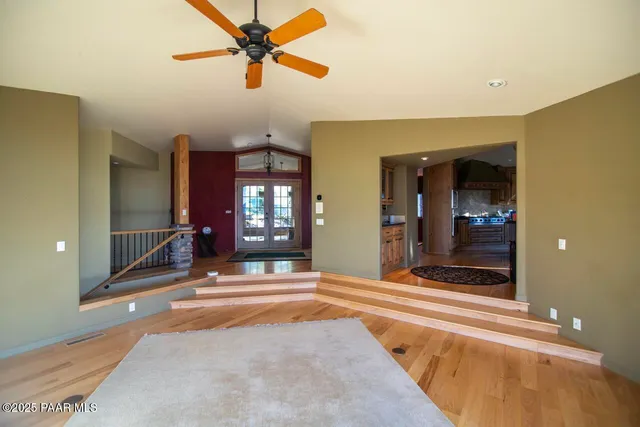 a view of an entryway with a table and chairs