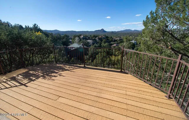 a bedroom with a bed and a mirror
