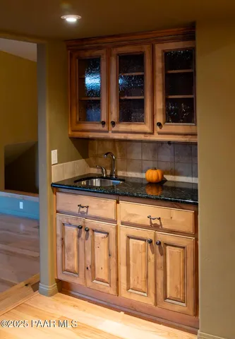 a kitchen with stainless steel appliances granite countertop a stove and a microwave