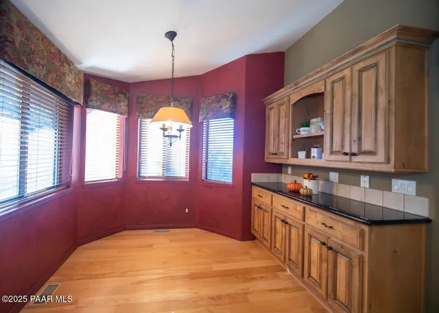 a kitchen with stainless steel appliances a sink stove and cabinets
