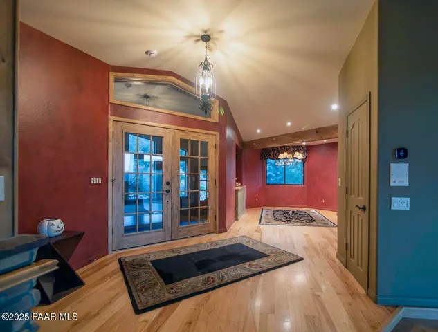 a spacious bathroom with a granite countertop sink a mirror and shower