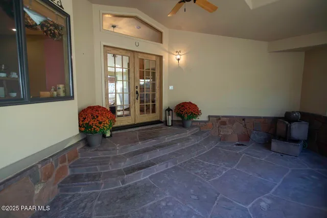 a view of a room with furniture and windows