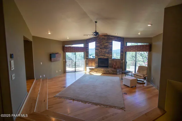 a living room with furniture window and wooden floor