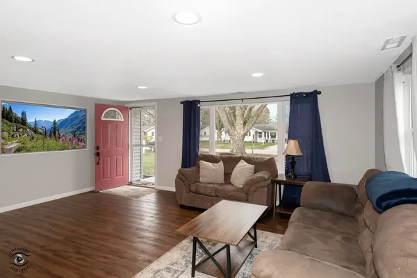 a living room with furniture and a large window