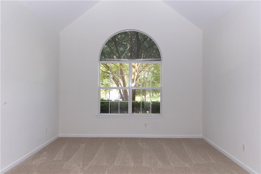 502 Streamside Place Canton, GA 30115 - Photo 3 of 33 an empty room with a window