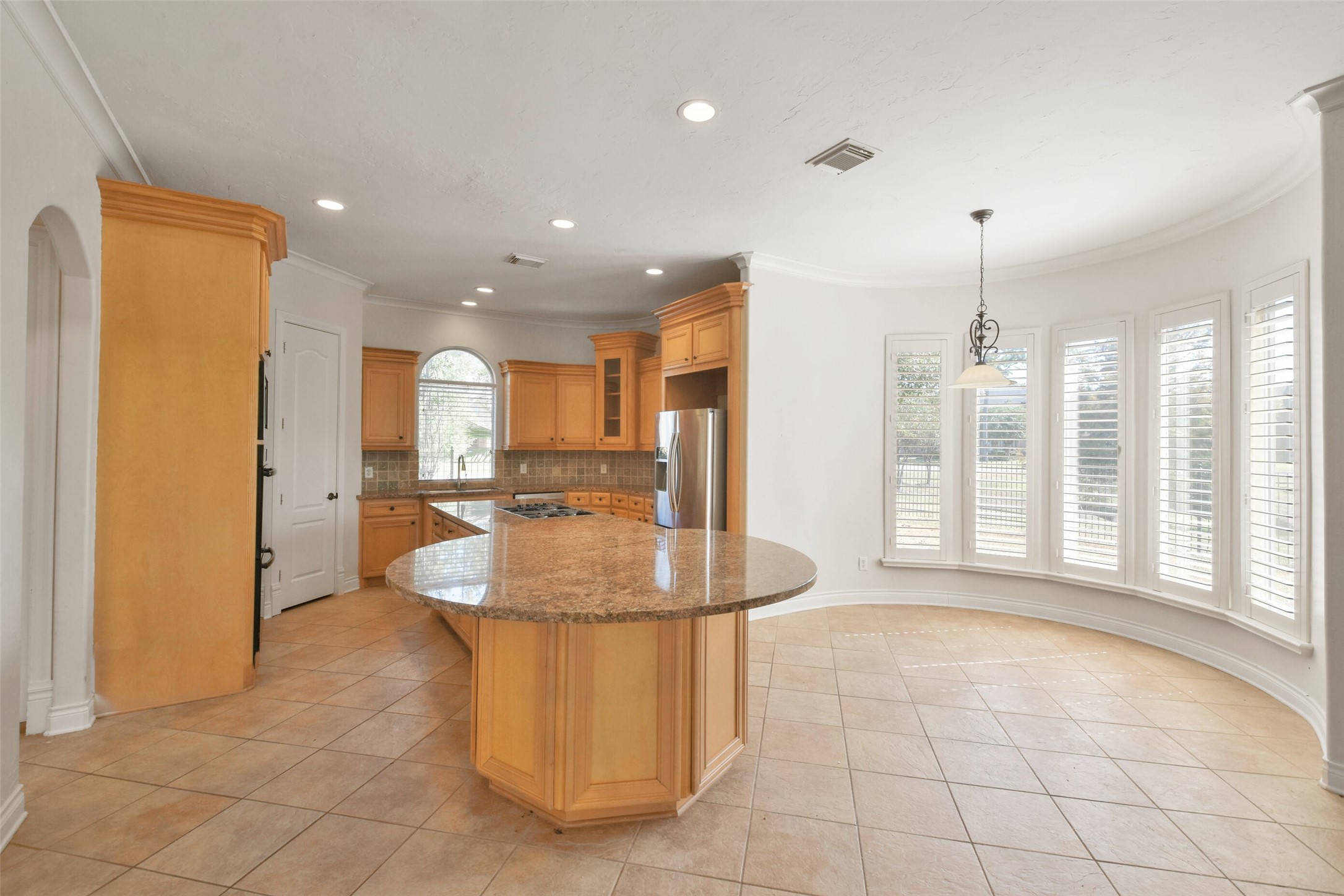 8114 Hideaway Lake Circle Spring, TX 77389 - Photo 10 of 50 a dining hall with stainless steel appliances granite countertop a refrigerator a sink a barbeque oven and a view of living room