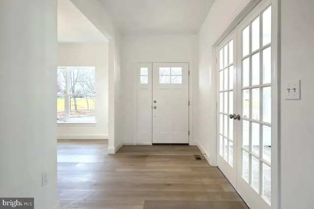 a view of entryway with wooden floor
