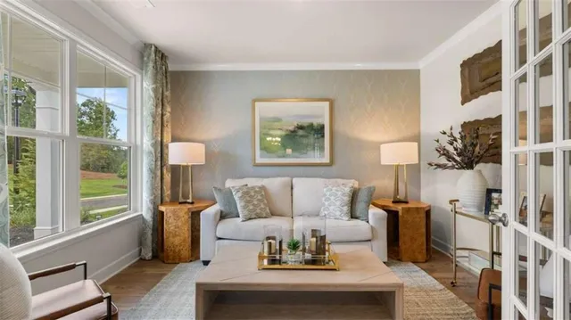 a living room with furniture and a large window