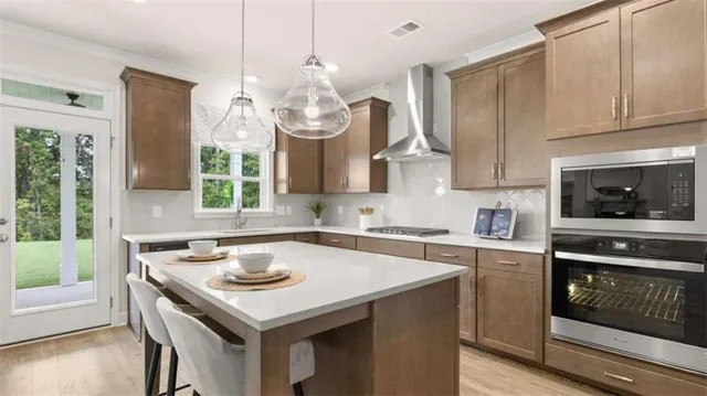 a kitchen with a sink a stove and cabinets