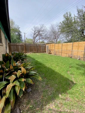 a backyard of a house with lots of green space