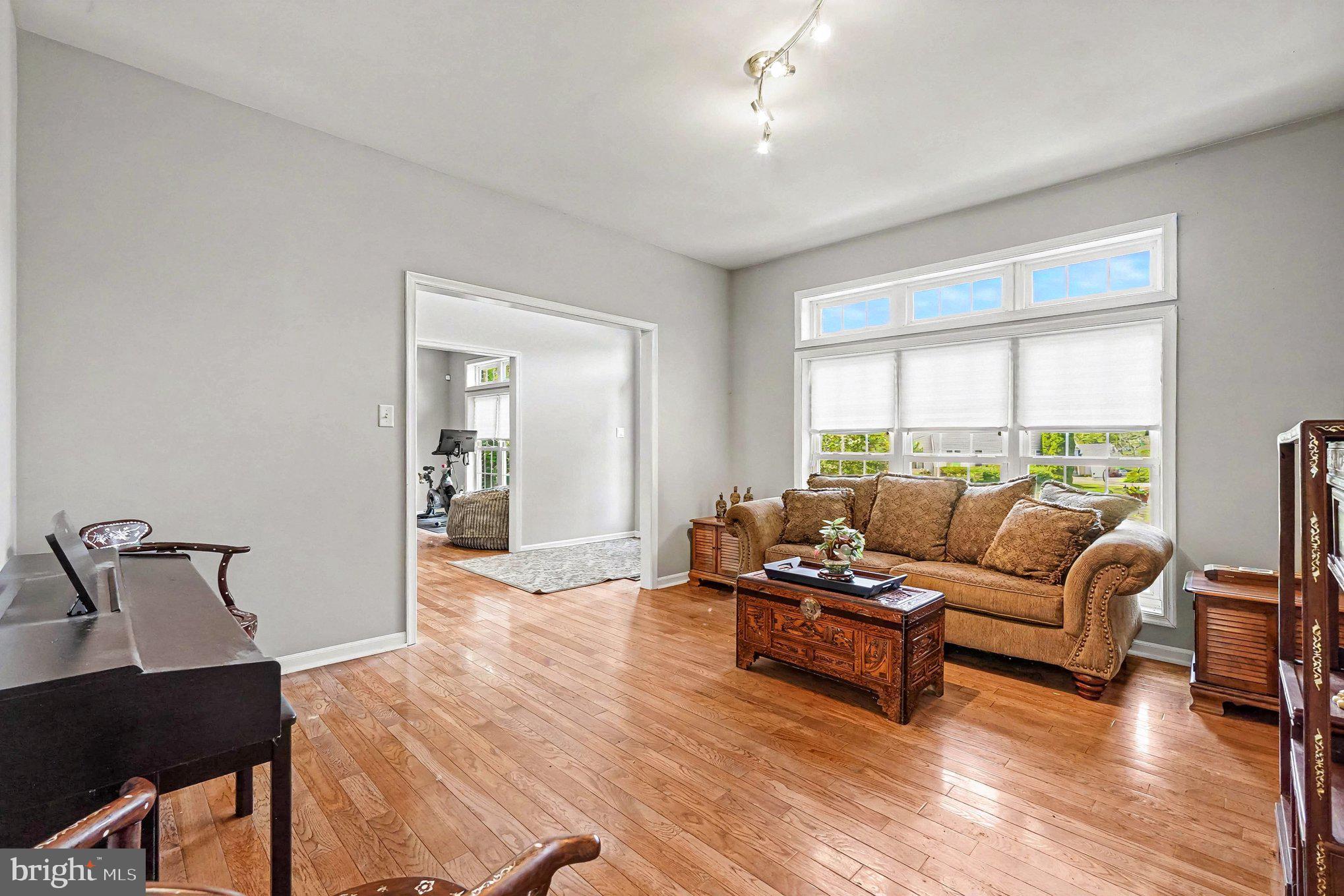64 Open Meadow Court Elkton, MD 21921 - Photo 12 of 57 a living room with furniture and wooden floor