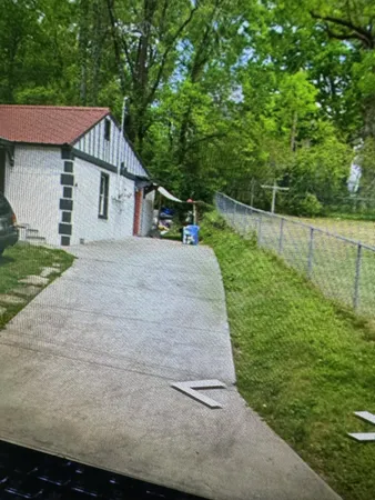 a house view with a garden space