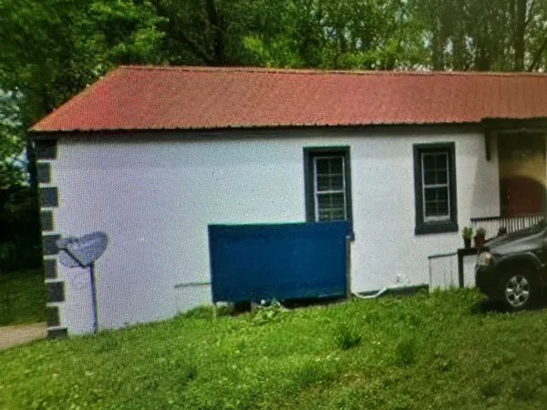 a aerial view of a house with table and chairs