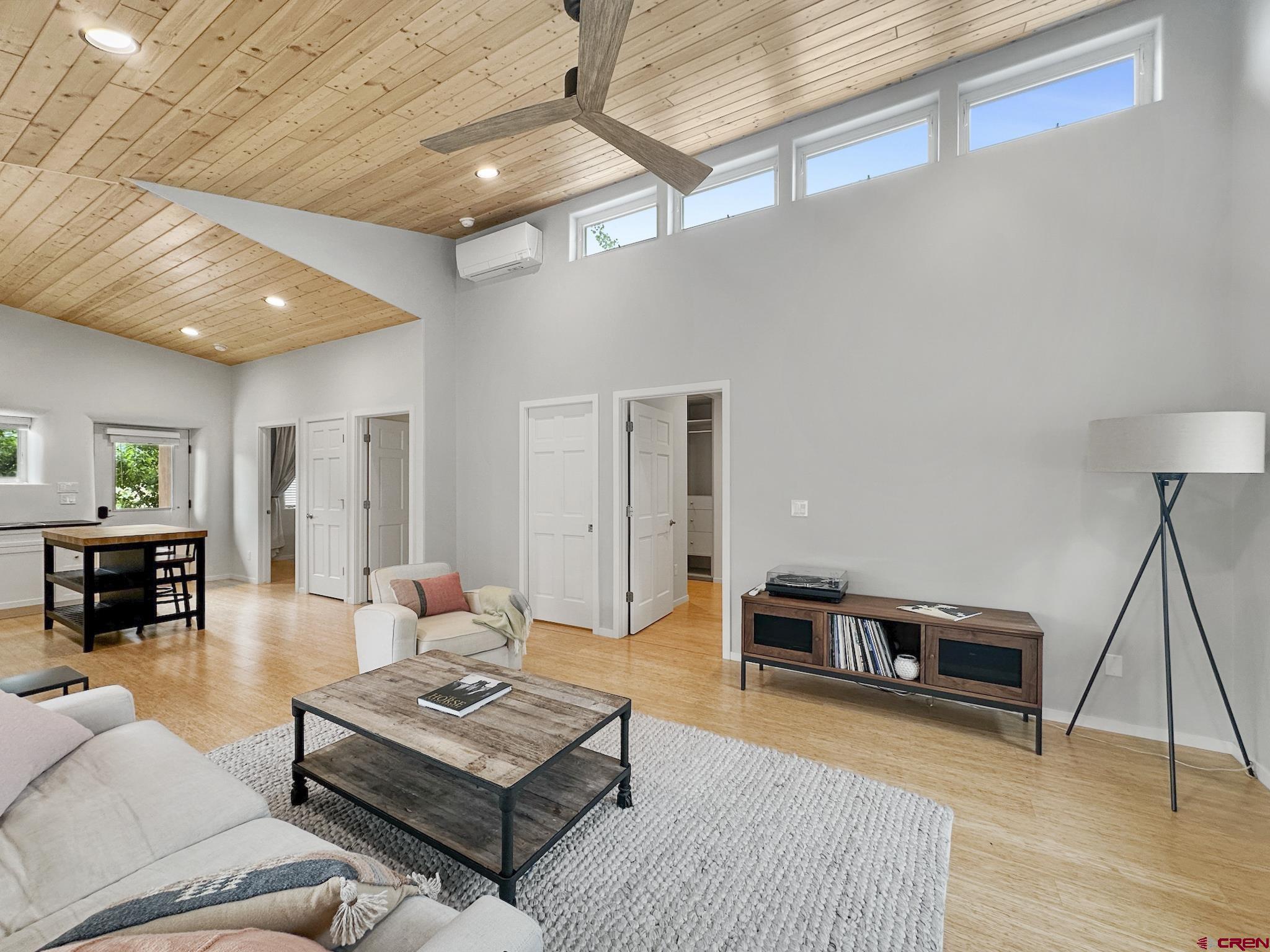 1200 3rd Street, Unit 6 Paonia, CO 81428 - Photo 12 of 34 a living room with furniture a wooden floor and a piano