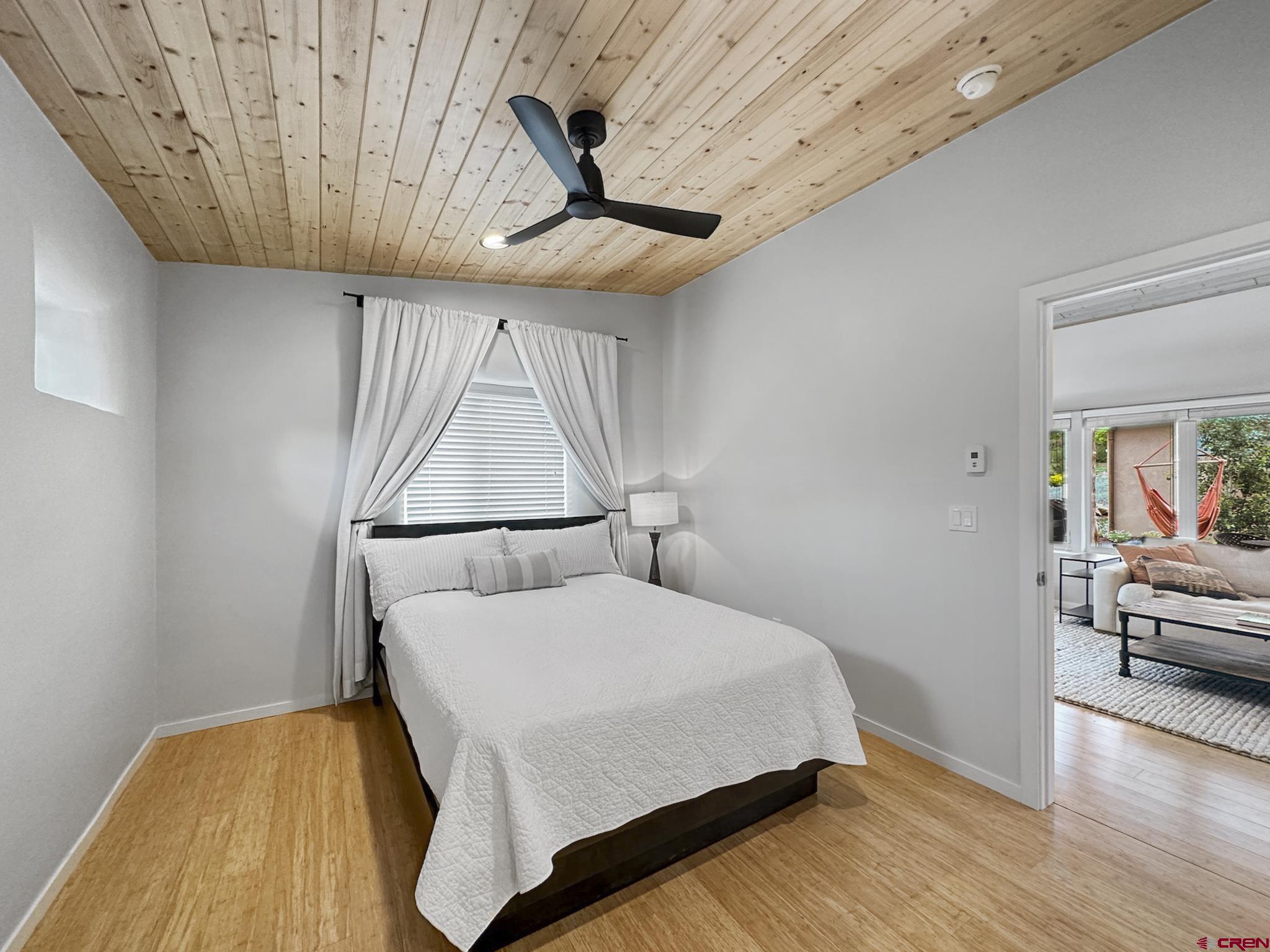 1200 3rd Street, Unit 6 Paonia, CO 81428 - Photo 14 of 34 a bedroom with a bed and a wooden floor