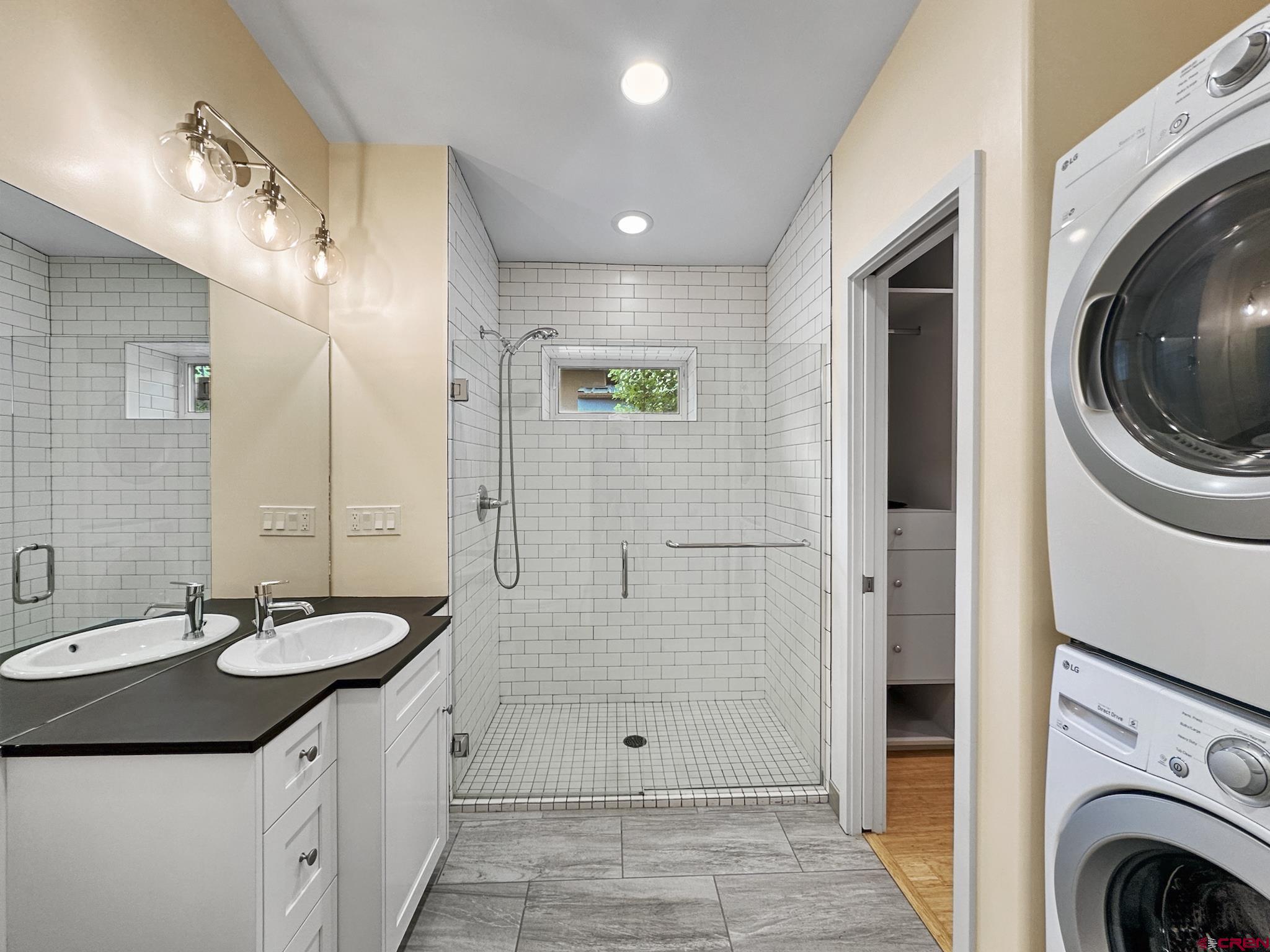1200 3rd Street, Unit 6 Paonia, CO 81428 - Photo 18 of 34 a bathroom with a sink a mirror and a shower