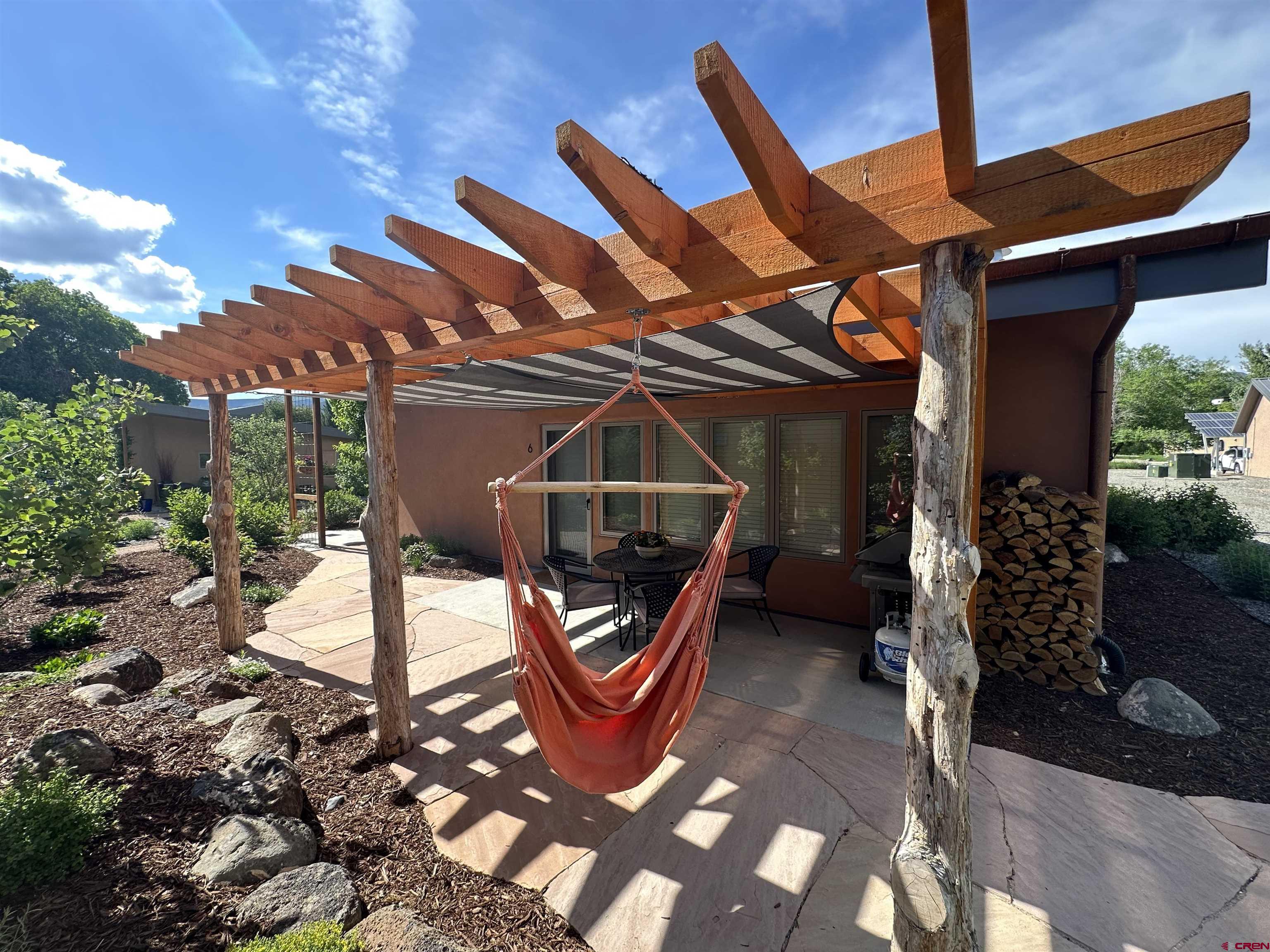 1200 3rd Street, Unit 6 Paonia, CO 81428 - Photo 2 of 34 a backyard of a house with seating space