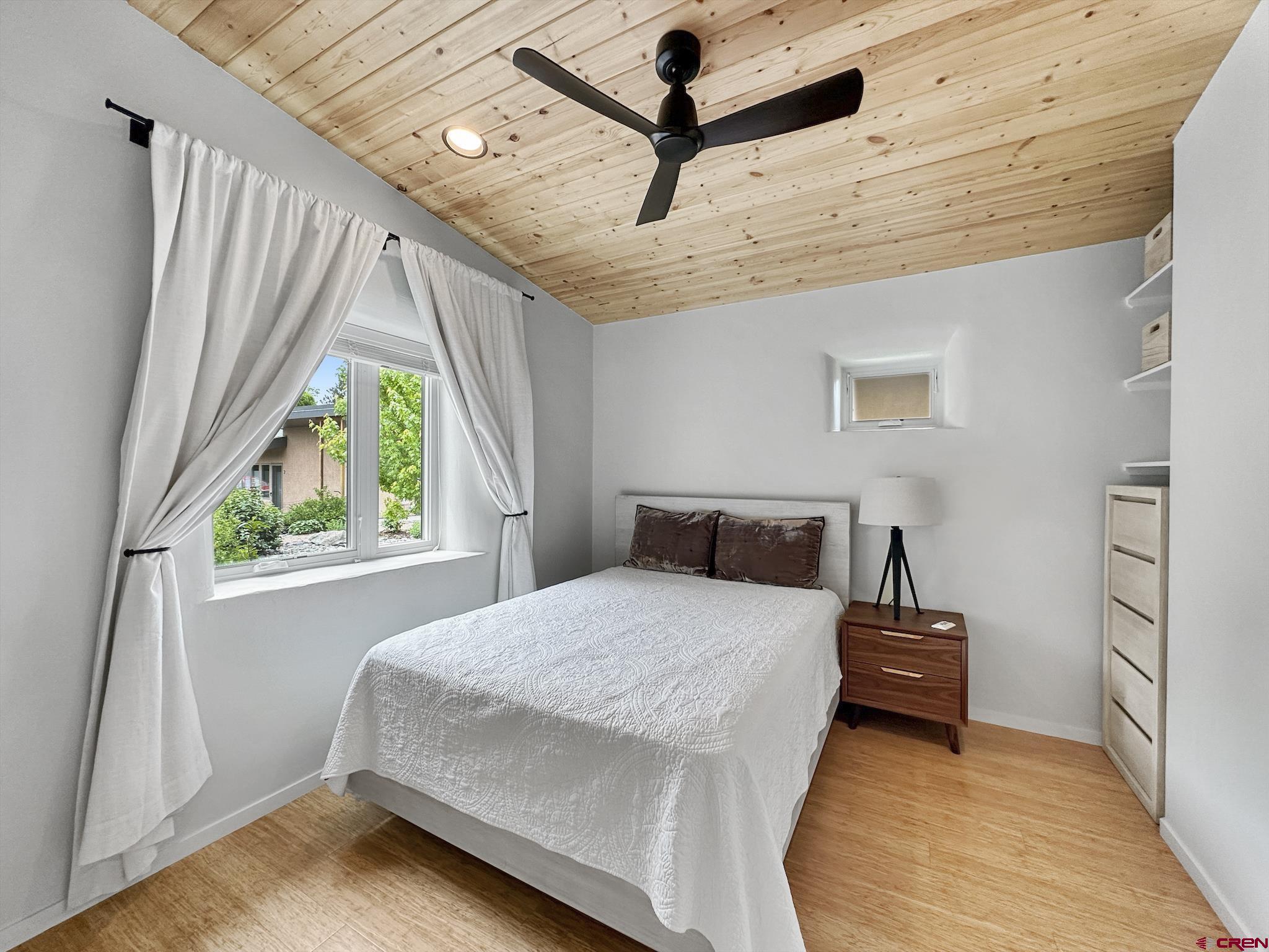 1200 3rd Street, Unit 6 Paonia, CO 81428 - Photo 21 of 34 a bedroom with a bed and a large window