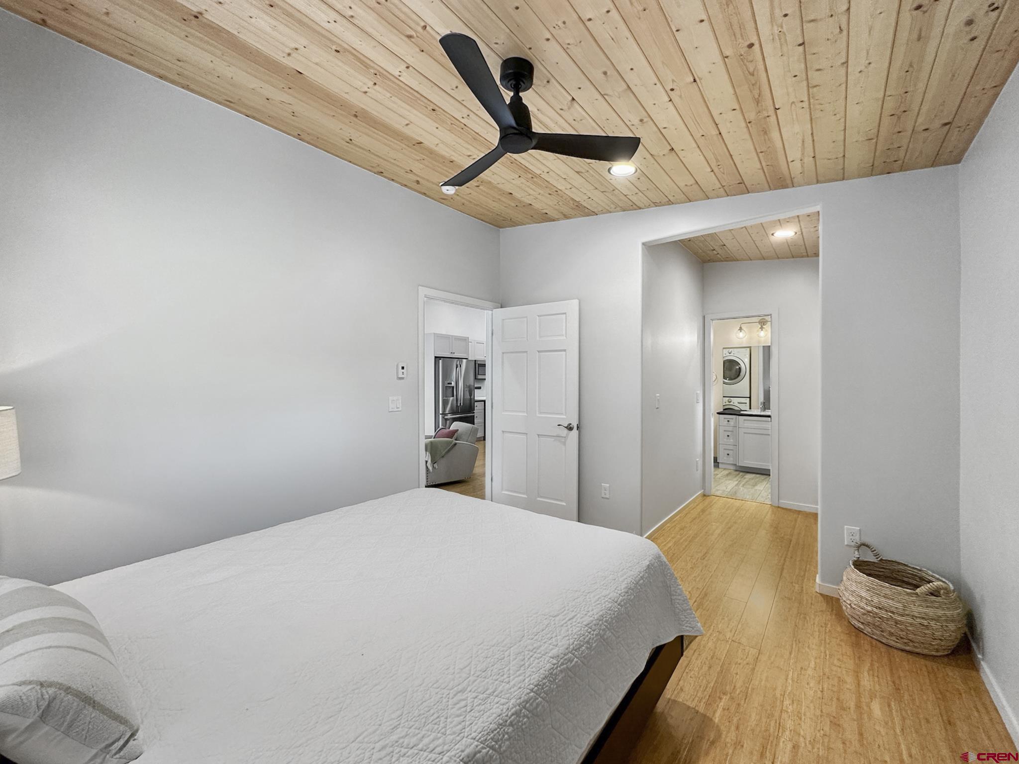 1200 3rd Street, Unit 6 Paonia, CO 81428 - Photo 22 of 34 a bedroom with a bed and wooden floor