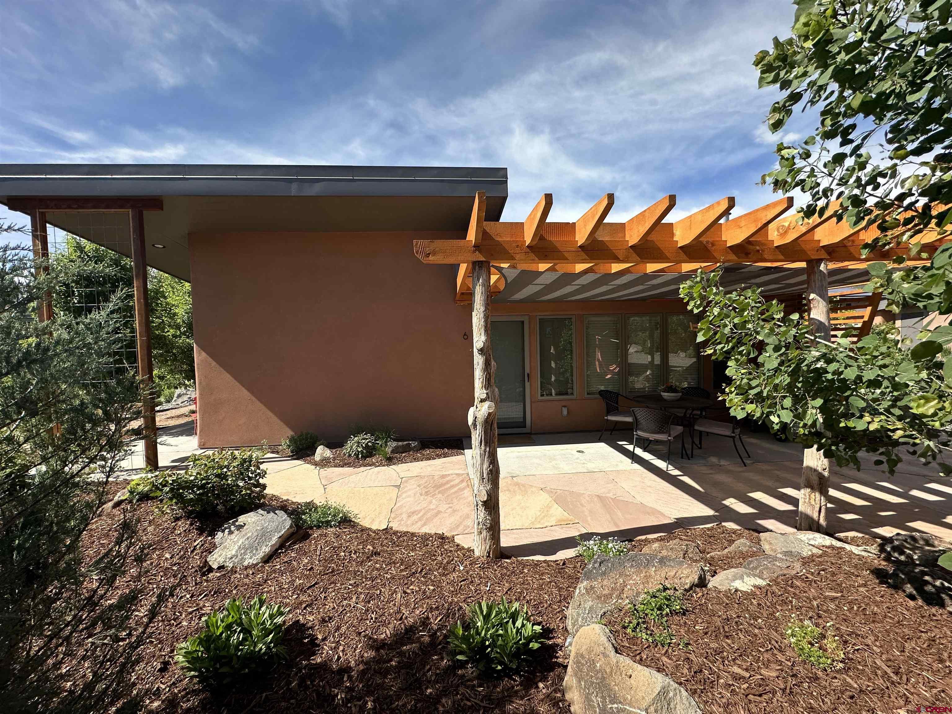1200 3rd Street, Unit 6 Paonia, CO 81428 - Photo 25 of 34 a backyard of a house with table and chairs