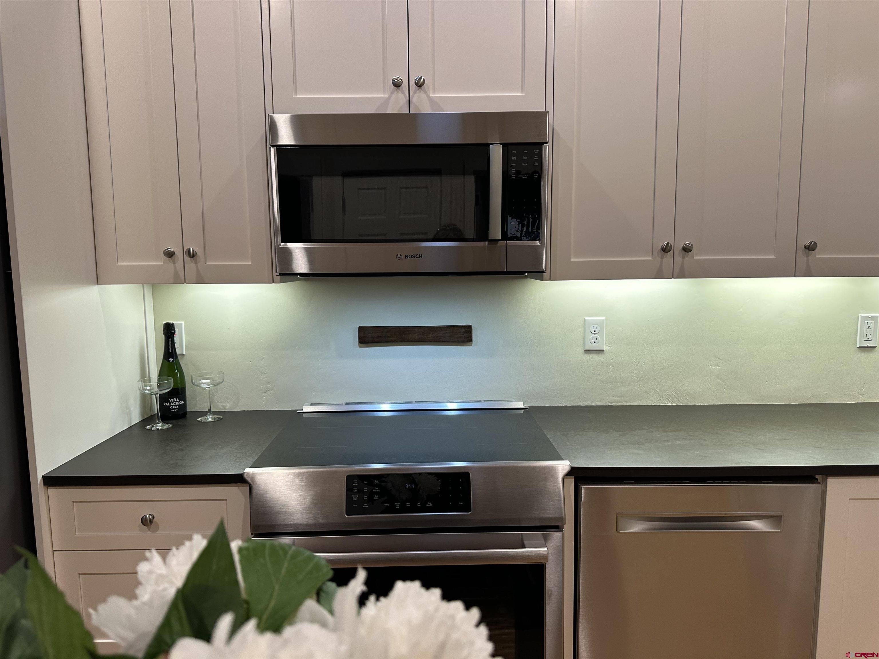 1200 3rd Street, Unit 6 Paonia, CO 81428 - Photo 29 of 34 a kitchen with a stove and a microwave