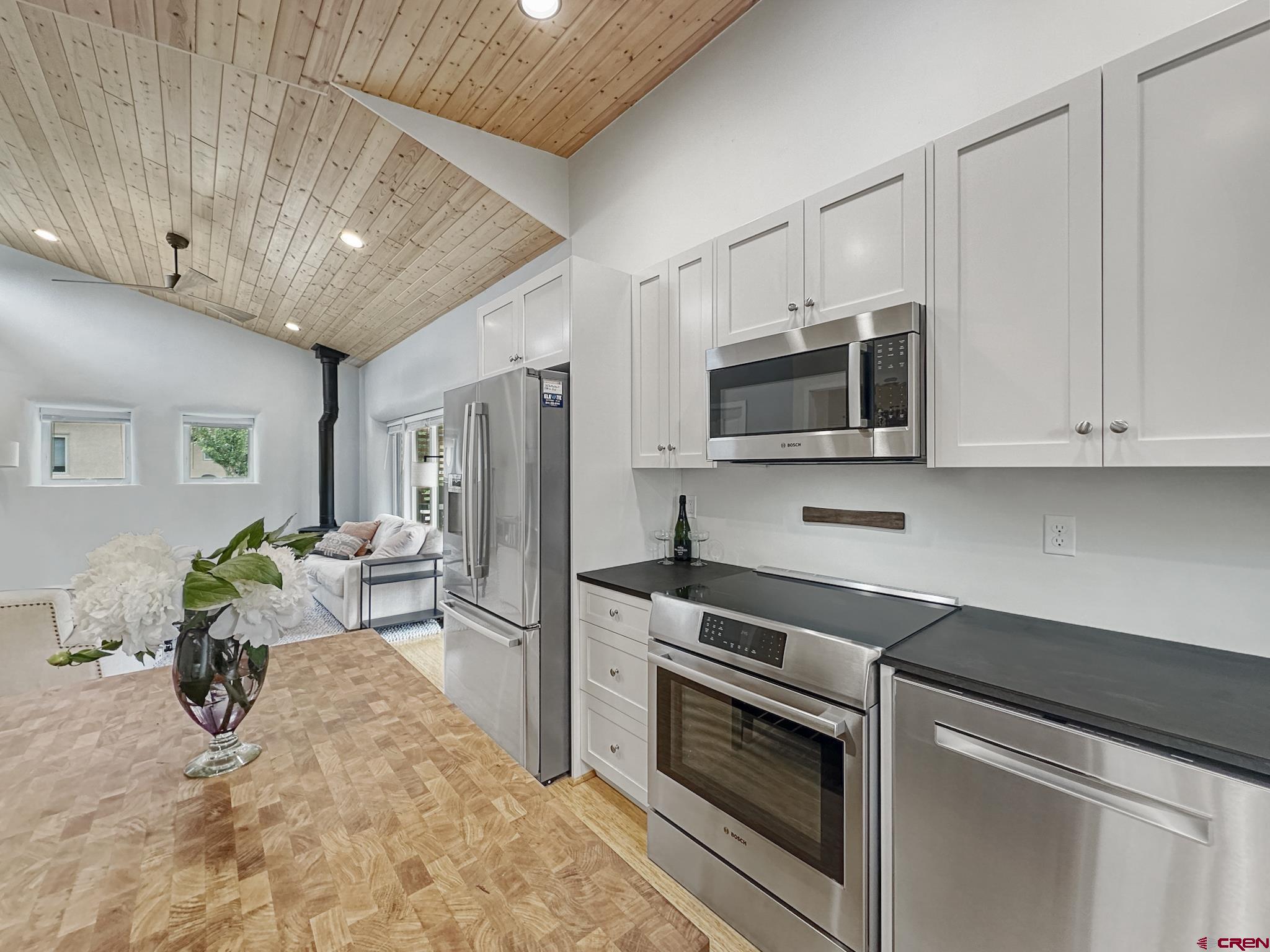 1200 3rd Street, Unit 6 Paonia, CO 81428 - Photo 9 of 34 a kitchen with stainless steel appliances a stove microwave and refrigerator