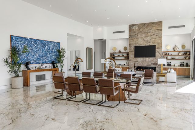 a living room with fireplace furniture and a flat screen tv