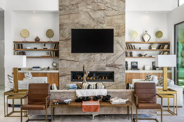 a living room with furniture and a fireplace