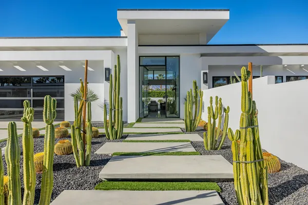a view of a house with a small garden